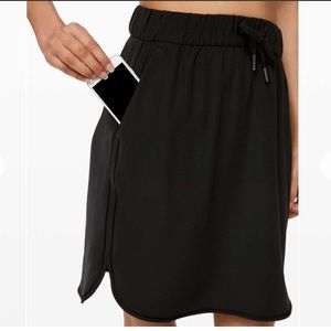 LIKE NEW Lululemon on the fly skirt black. Size 4.